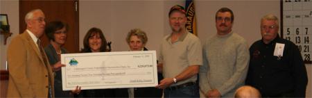 James Boser, Cattaraugus County Vice Chairman of the Agriculture and Development Committee  Crystal Abers Chairman of the Cattaraugus County Legislature  Lisa Foster, Secretary of the Cattaraugus County Federation of Snowmobile Clubs  Cathy Hill, Treasurer of the Cattaraugus County Federation of Snowmobile Clubs  Allan Bekiel, Vice President of the Cattaraugus County Federation of Snowmobile Clubs  Tom Hill, President of the Cattaraugus County Federation of Snowmobile Clubs  George Couell, NYSSA (New York State Snowmobile Association) Director for Cattaraugus County and Trail Coordinator for Cattaraugus County