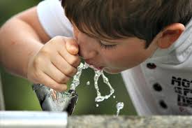 Boy at drinking fountain Boy at drinking fountain