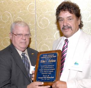 (l-r) Michael Hutchinson, recipient of the Brooks Patterson Community Leadership Award for 2010 and Charles Couture, Chairman, Cattaraugus County Planning Board. Photo by Jack Berger